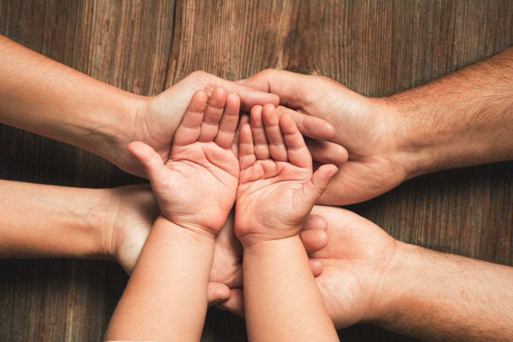 Three hands of family. Love, togetherness, happiness in family concept