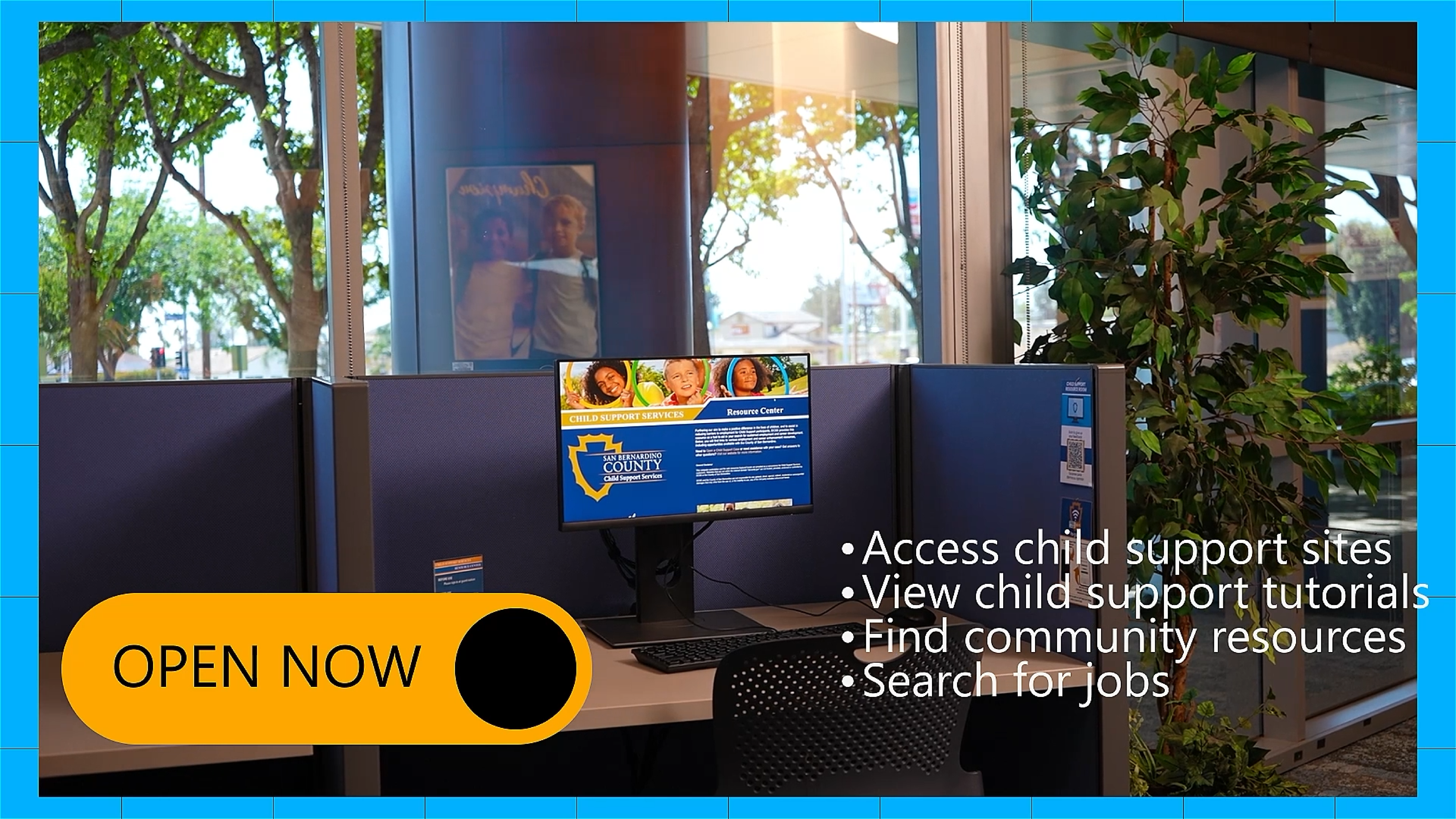 A computer workstation inside an office with blue cubicle dividers and a monitor displaying a San Bernardino County Child Support Services website. To the right, text lists services such as accessing child support sites, viewing tutorials, finding community resources, and searching for jobs. A bright yellow “OPEN NOW” button is overlaid on the image. Green trees and a plant are visible through large windows.